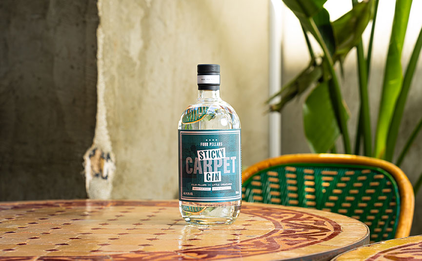 Four Pillars Sticky Carpet bottle on a table at a bar