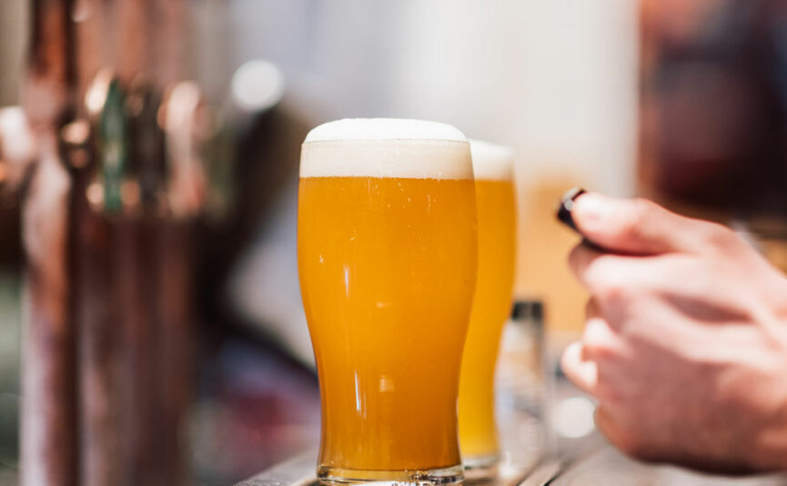 Pints of beer on a bar